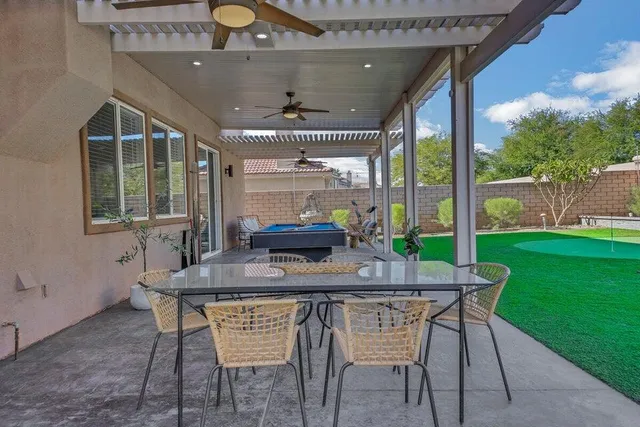 a view of outdoor space with swimming pool and furniture