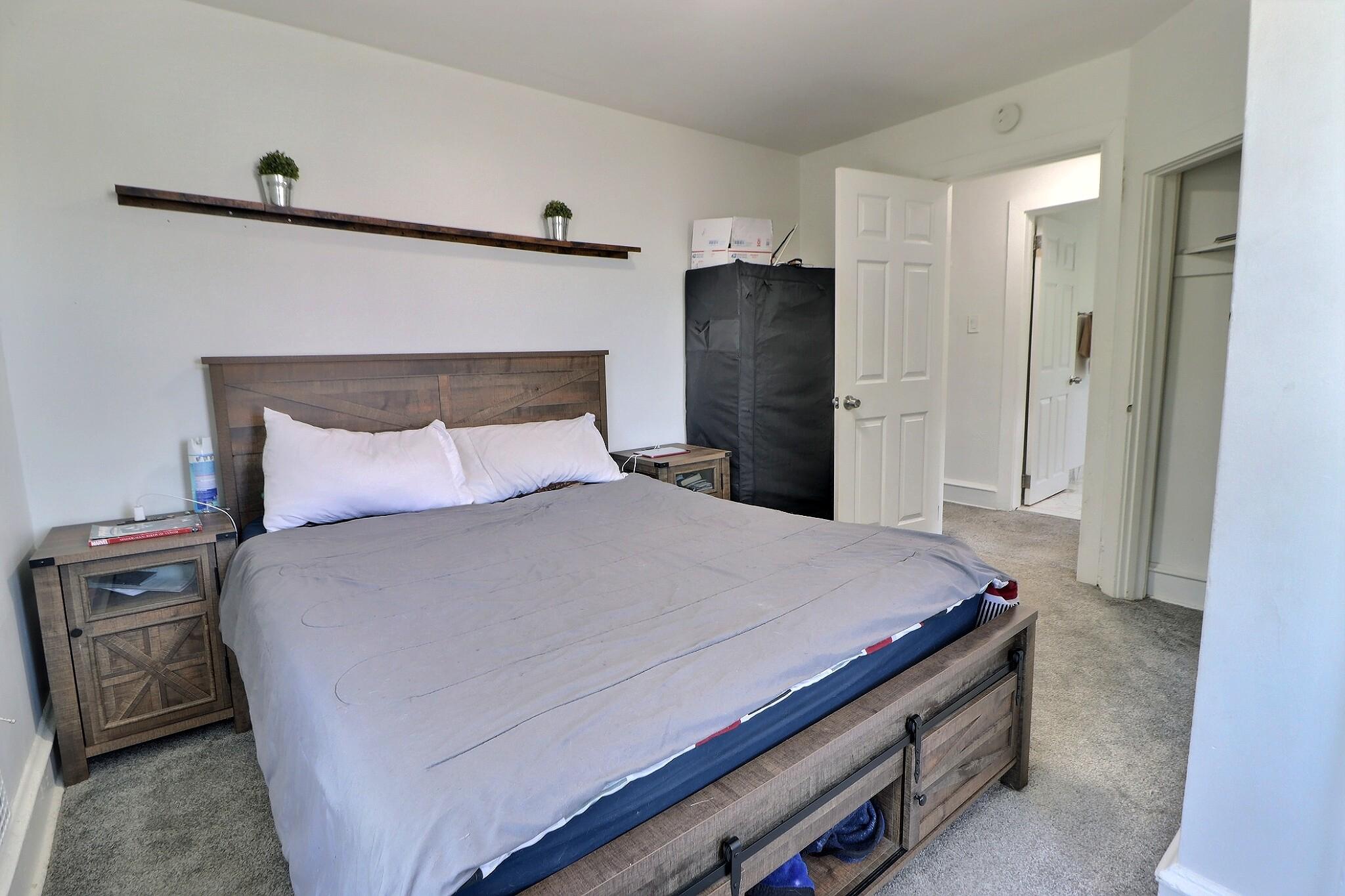 1022 Penn Line Road Paulsboro, NJ 08066 - Photo 16 of 19 a bedroom with a bed and a night stand