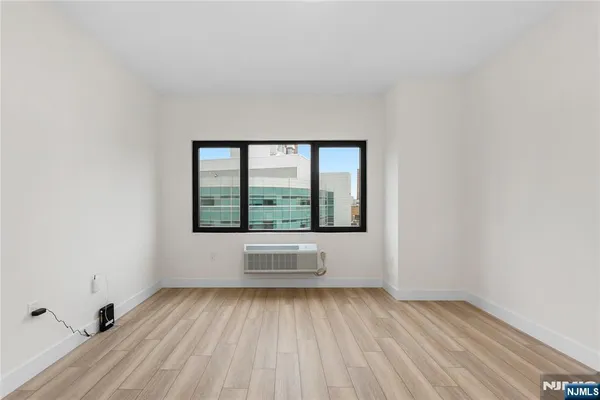 a kitchen with a refrigerator and cabinets