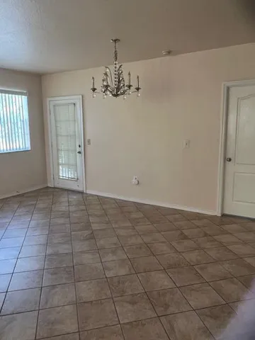 a kitchen with stainless steel appliances a refrigerator sink and microwave