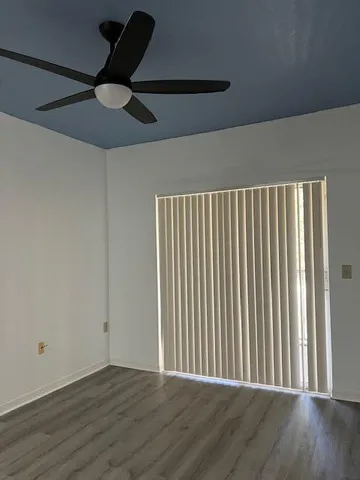 an empty room with wooden floor