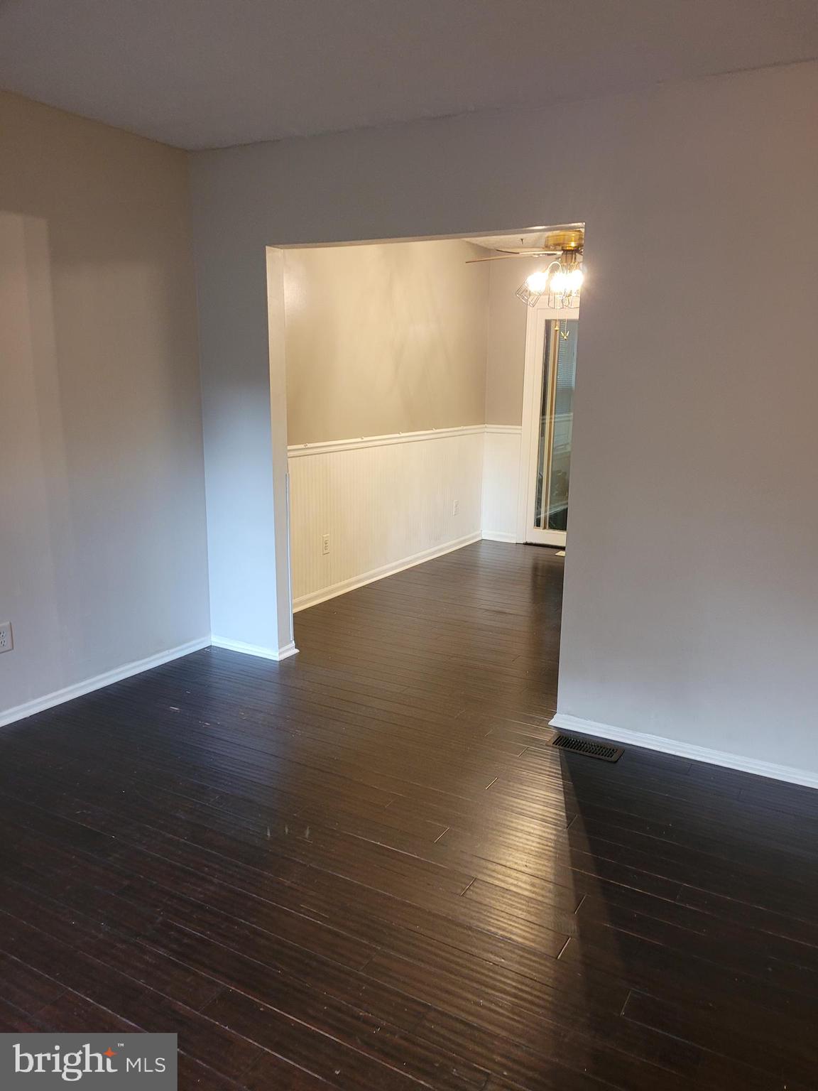 7739 Harmans Road Hanover, MD 21076 - Photo 3 of 13 Living & dining with new paint and bamboo floors.
