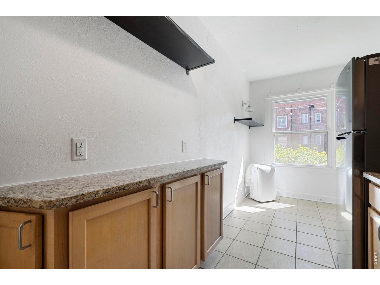 1416 North Downing Street, Unit 2 Denver, CO 80218 - Photo 11 of 12 a bathroom with a granite countertop sink a toilet and a bathtub