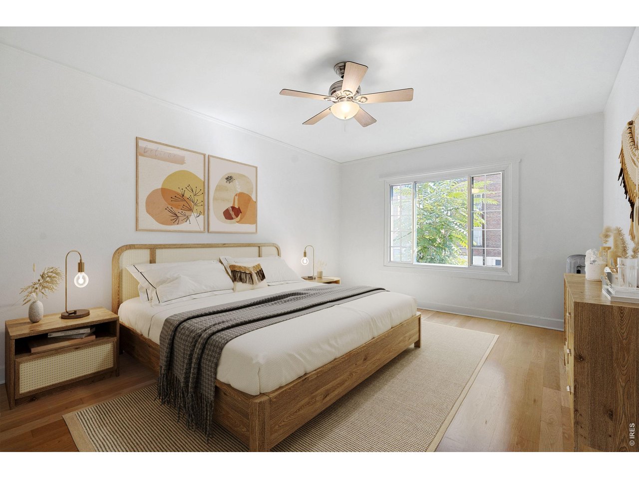 1416 North Downing Street, Unit 2 Denver, CO 80218 - Photo 6 of 12 a bedroom with a large bed and a chandelier