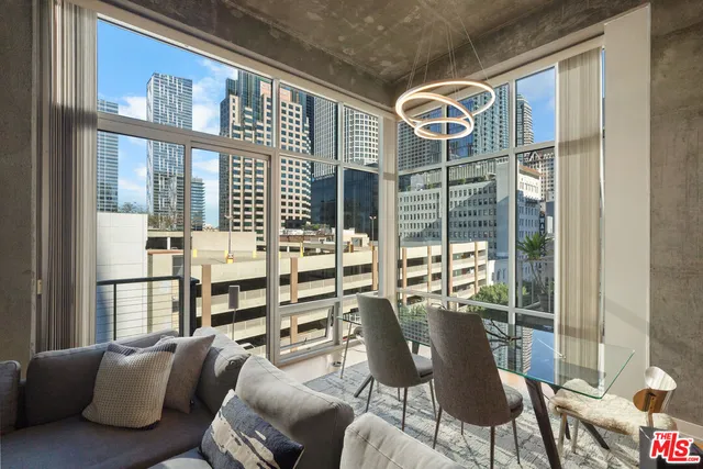 a view of a dining room with furniture window and outside view