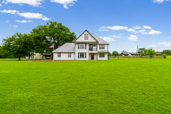 a bedroom with bed and window