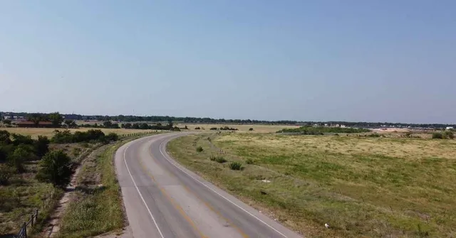 a view of a swimming pool and an outdoor seating