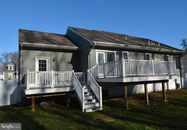 a view of house with porch and furniture