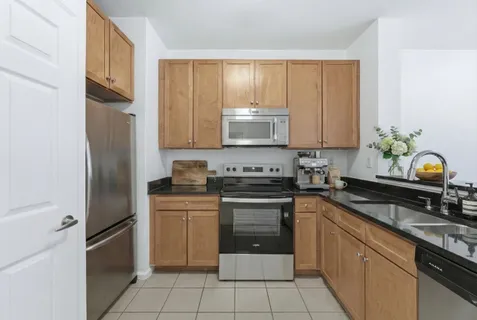 a kitchen with a sink stove and refrigerator
