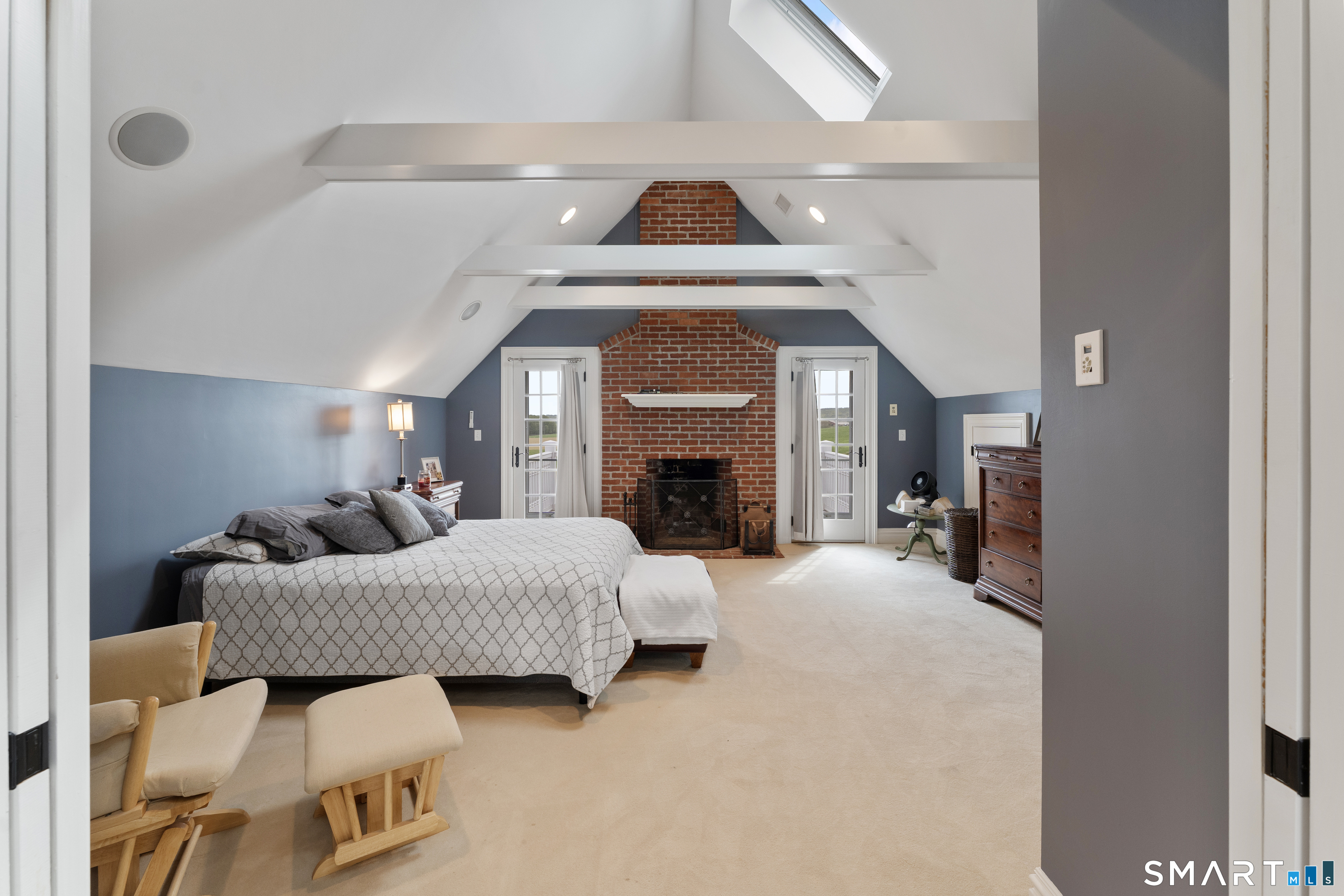155 Paine Road Woodstock, CT 06281 - Photo 34 of 40 a bedroom with furniture and a fireplace