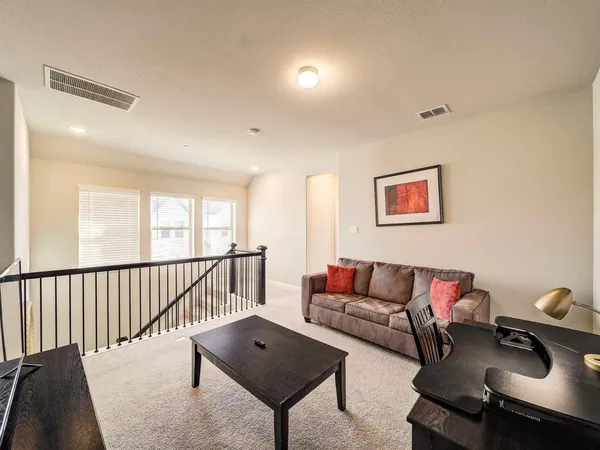 a living room with furniture and a couch
