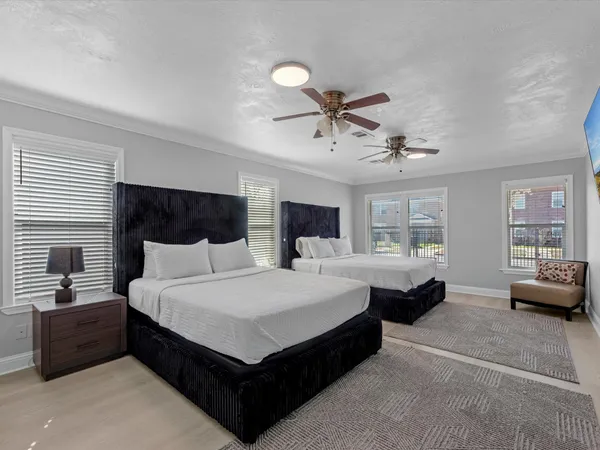 a bedroom with a large bed and a couch