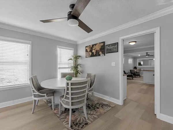 a dining room with furniture and window