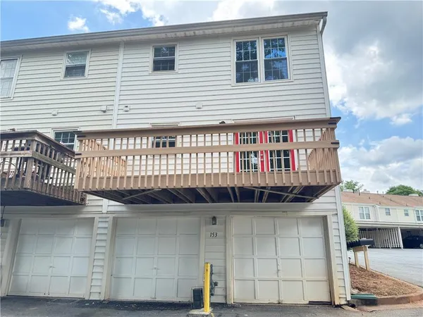 a front view of a house with garage
