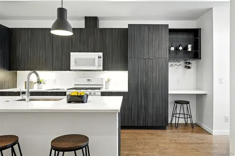 a kitchen with a sink cabinets and window