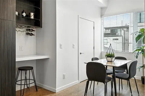 a view of a dining room with furniture and window