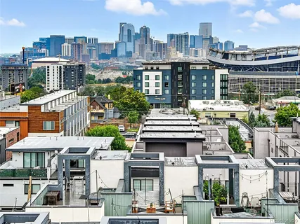 a view of a white house with large windows and a sink