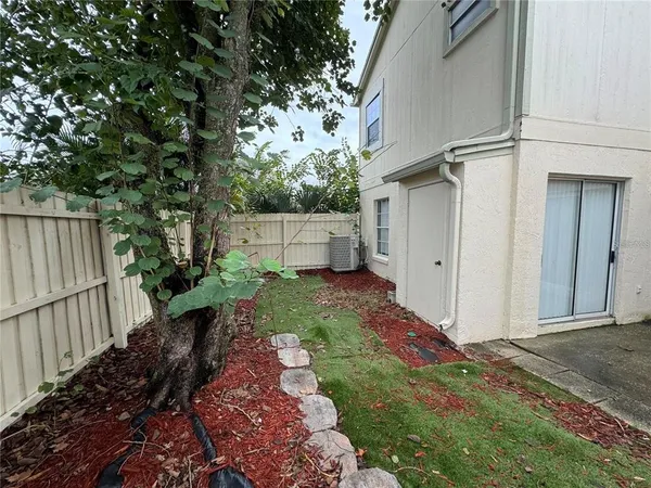 a view of a backyard with pathway