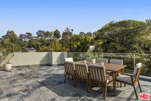a view of a chairs and table on the terrace