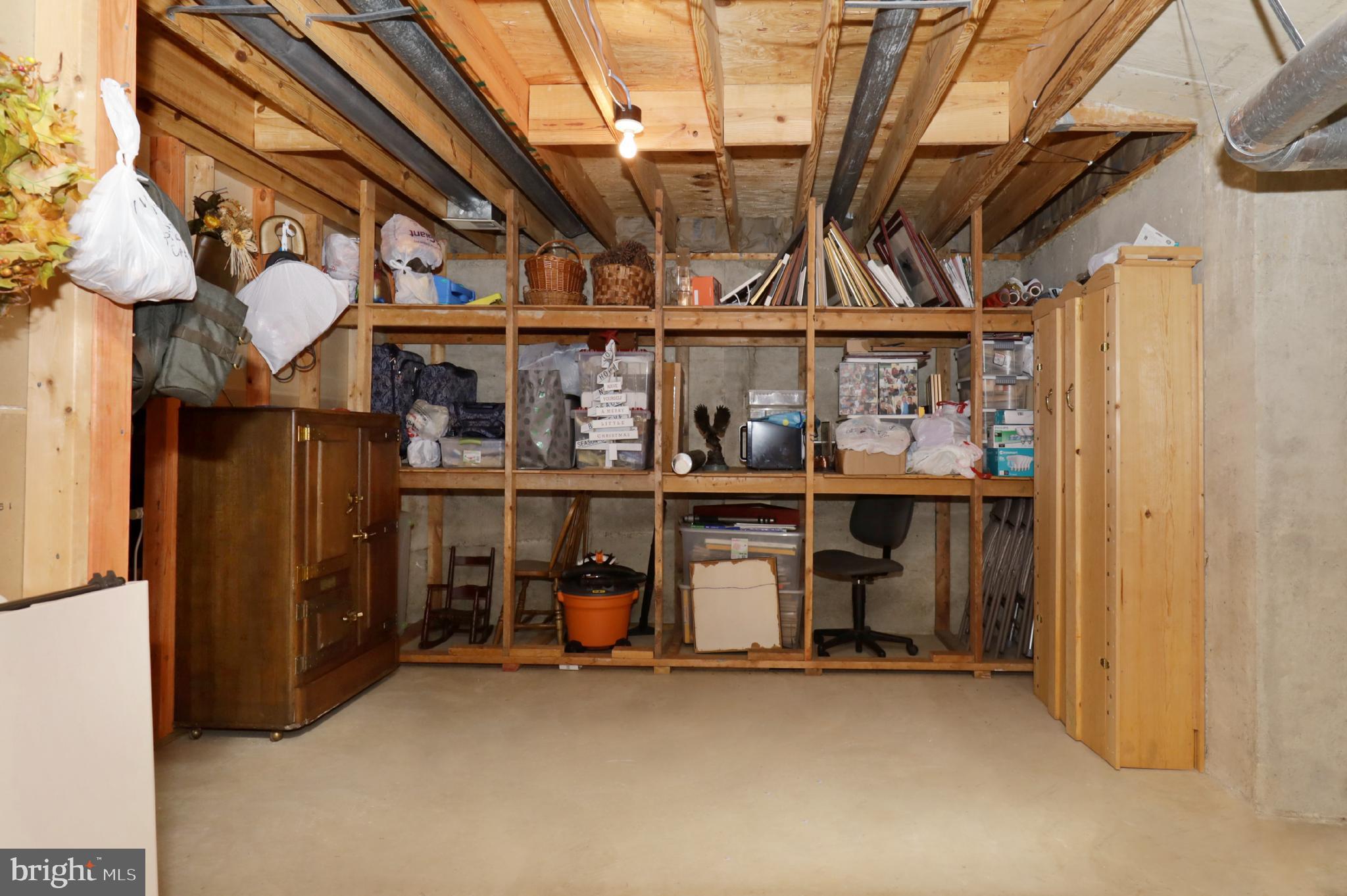 7616 Bertito Lane Springfield, VA 22153 - Photo 50 of 54 Storage Room with Workbench & Wood Shelving