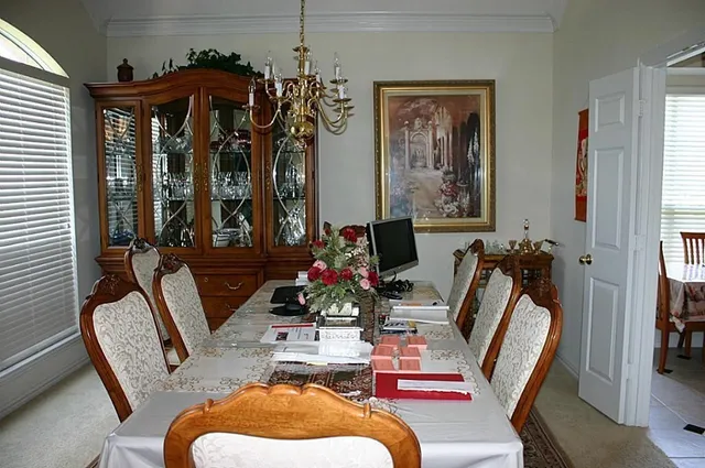 a room with furniture a chandelier and a window