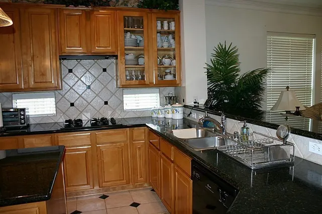 a kitchen with a sink and cabinets