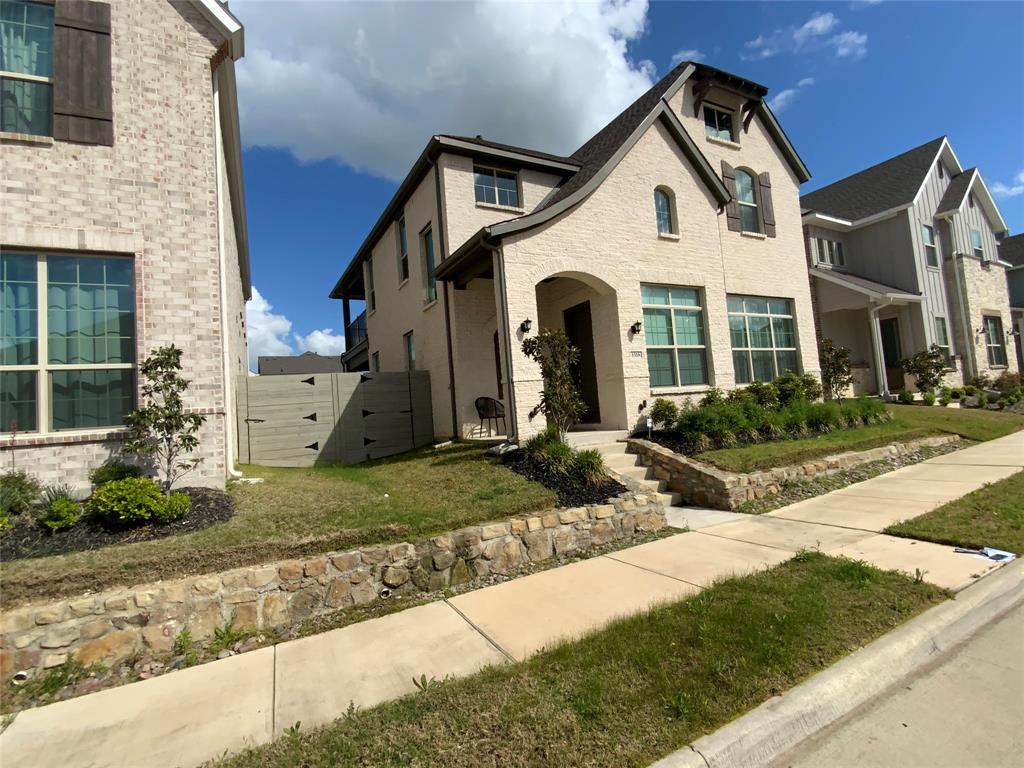 3318 Scotsman Road Sachse, TX 75048 - Photo 2 of 9 French country style house featuring a gate, brick siding, and a porch