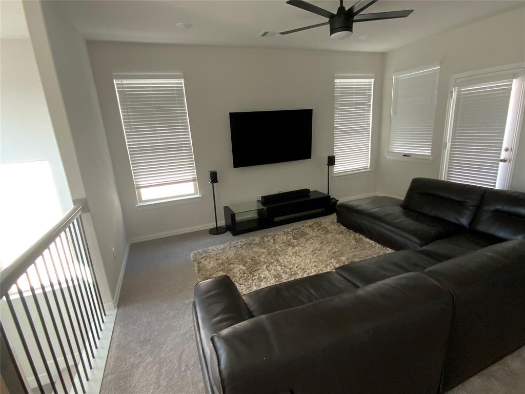 3318 Scotsman Road Sachse, TX 75048 - Photo 5 of 9 Living room featuring ceiling fan and carpet floors