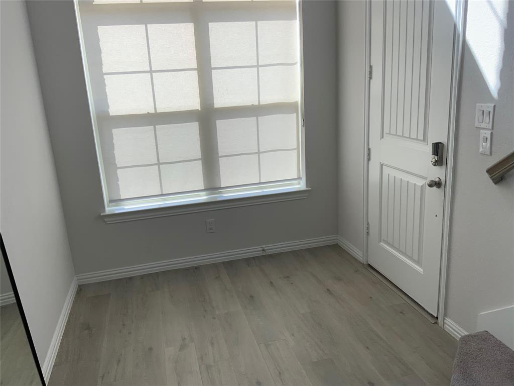3318 Scotsman Road Sachse, TX 75048 - Photo 8 of 9 Entrance foyer with light wood-style flooring and baseboards