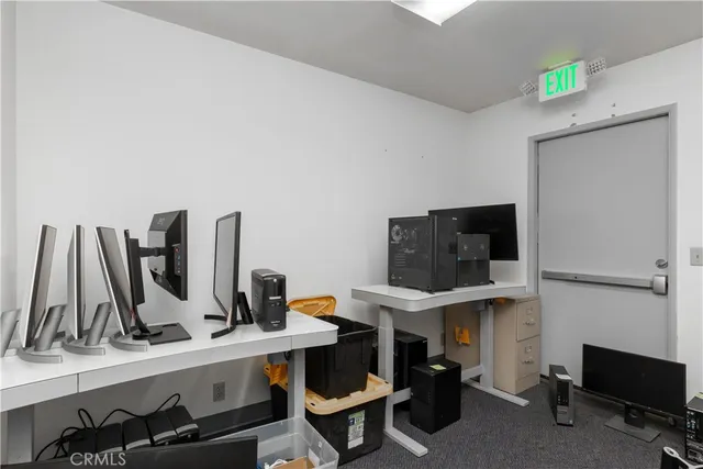 a view of a workspace with furniture