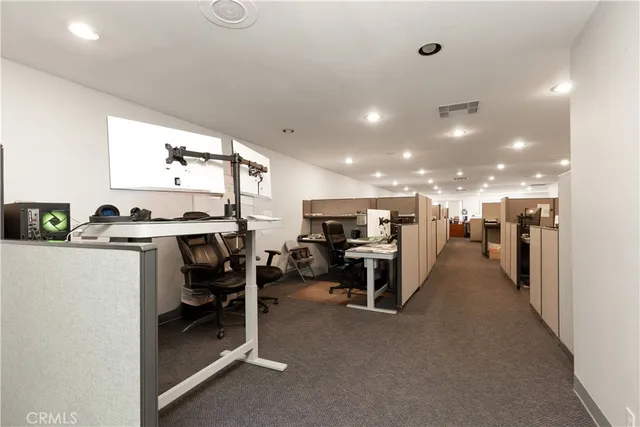 a room with furniture and a book shelf