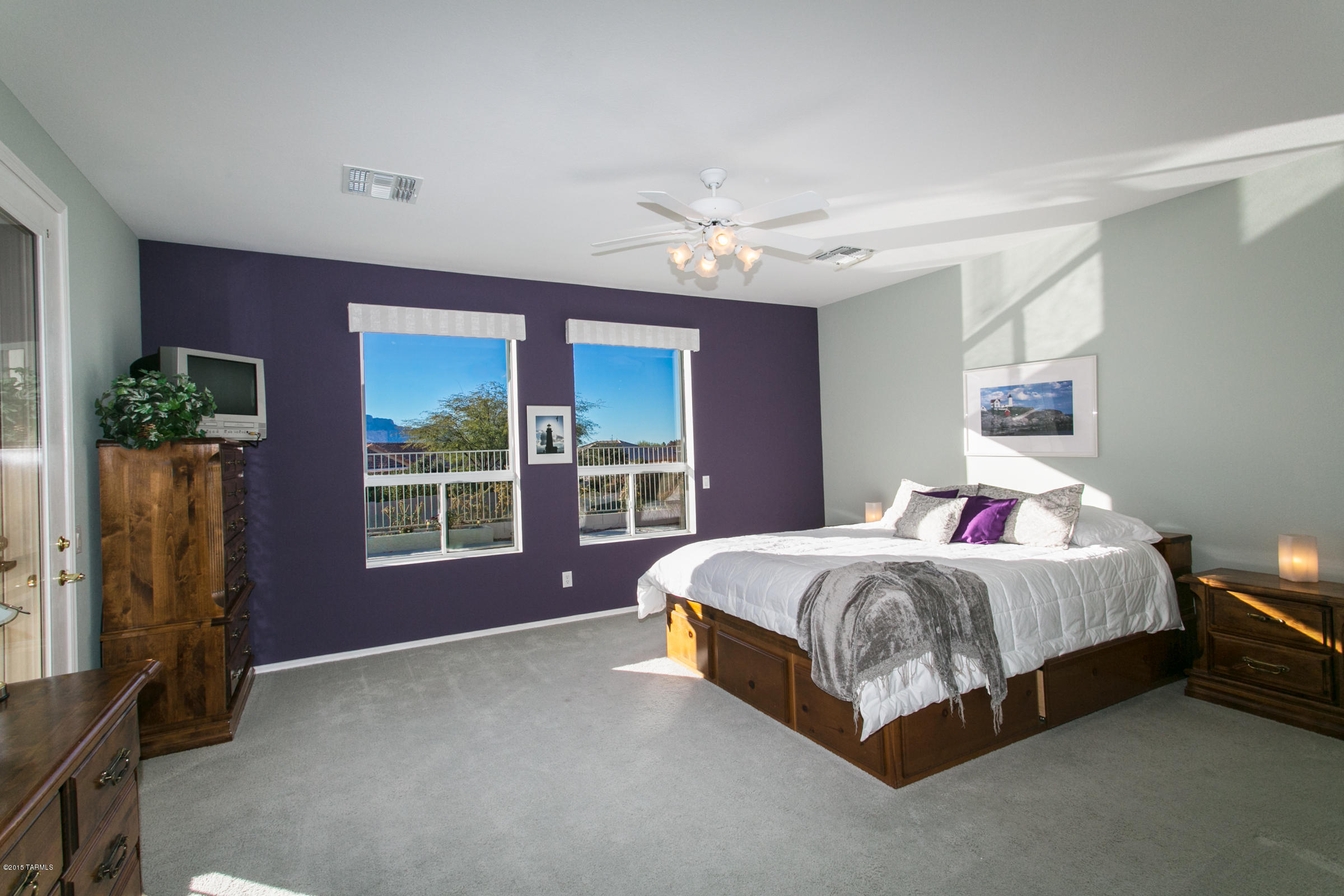 62419 East Northwood Road Tucson, AZ 85739 - Photo 21 of 30 a bed room with a bed and a window