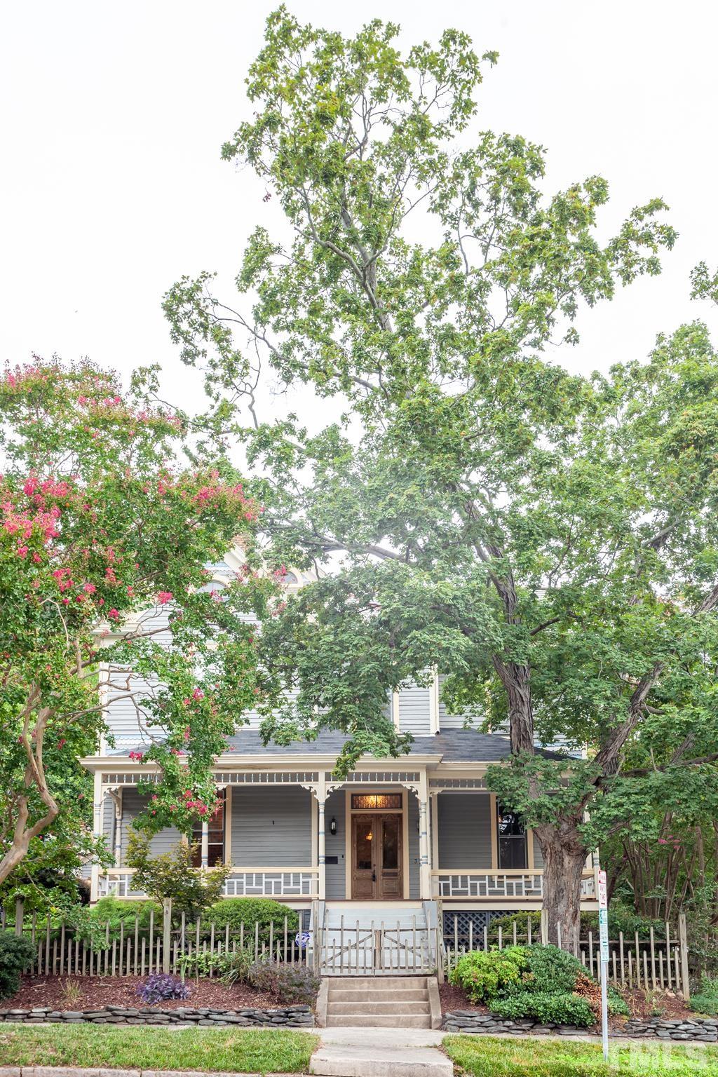 323 East Lane Street Raleigh, NC 27601 - Photo 2 of 42 a front view of a house with a yard