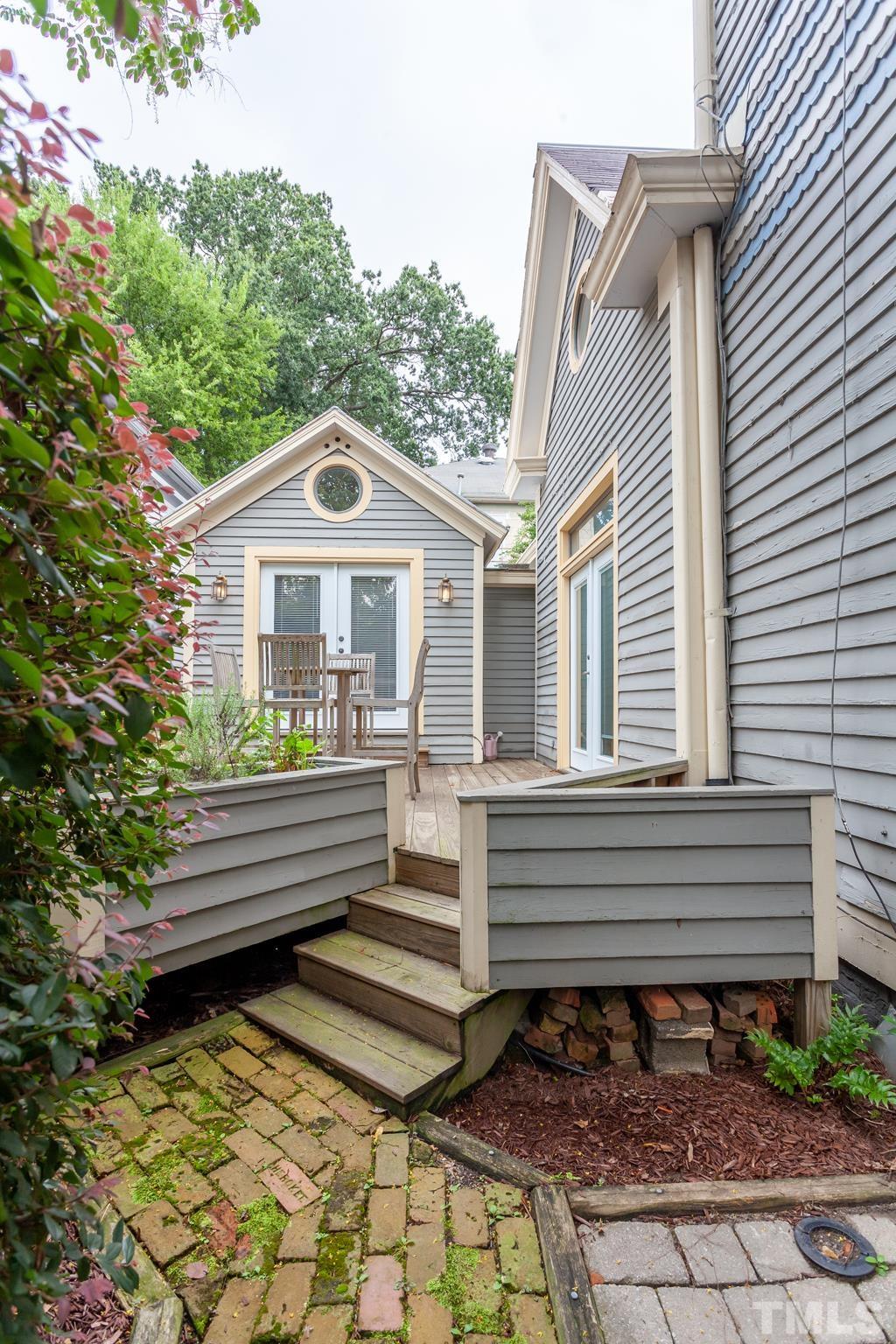 323 East Lane Street Raleigh, NC 27601 - Photo 38 of 42 a front view of a house with a yard