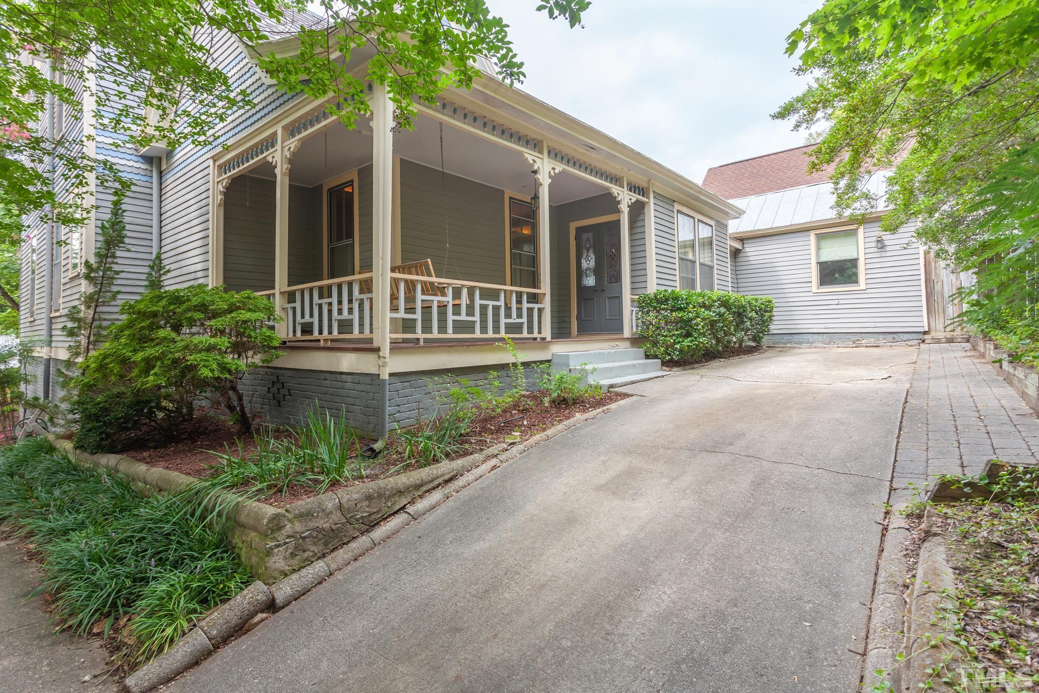 323 East Lane Street Raleigh, NC 27601 - Photo 41 of 42 front view of a house with a yard