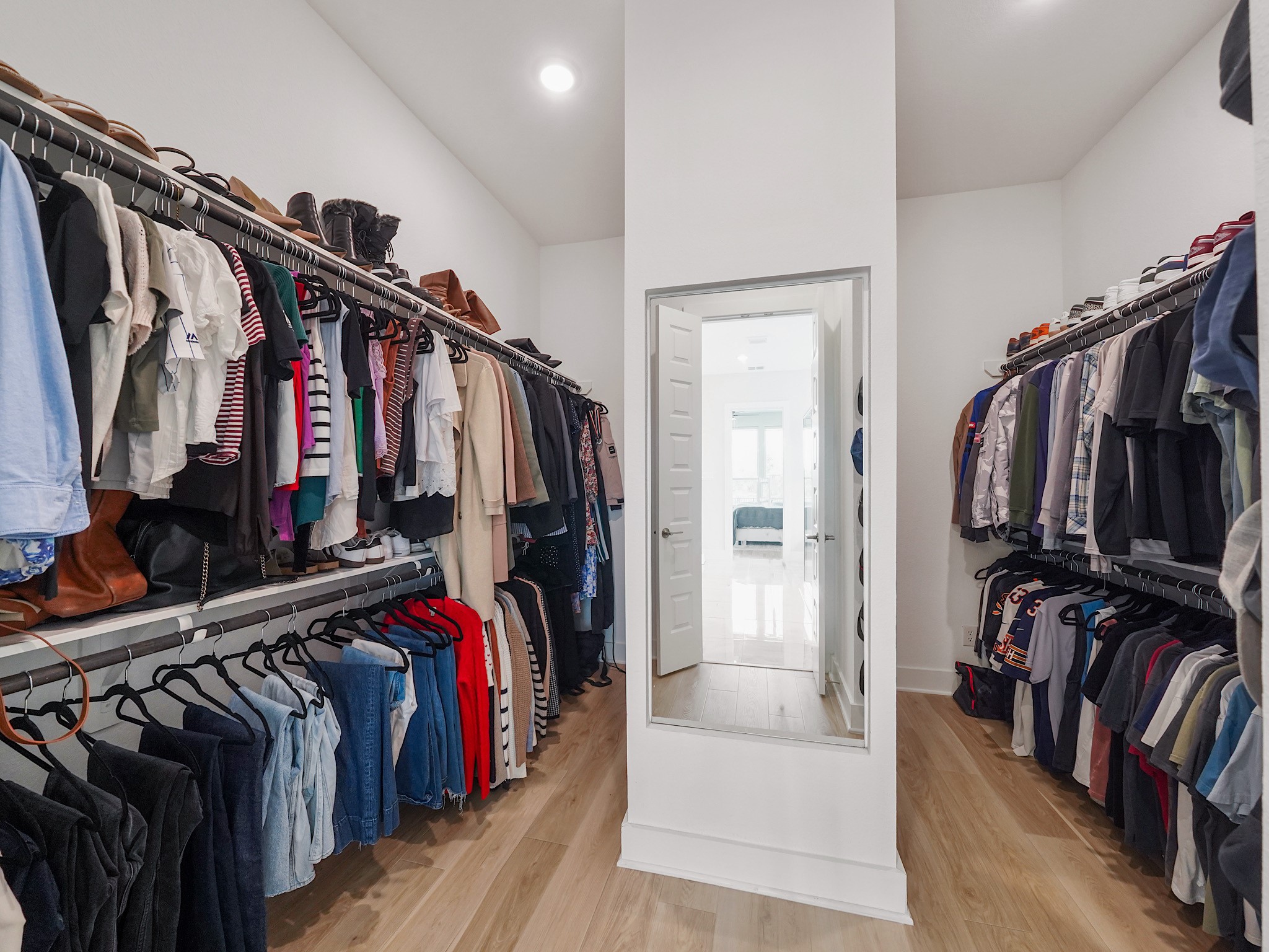 5802 Emerald Ranch Lane Fulshear, TX 77441 - Photo 27 of 45 The expansive walk-in closet offers impressive storage with custom organization and plenty of room for wardrobes, seasonal storage, and everyday convenience.