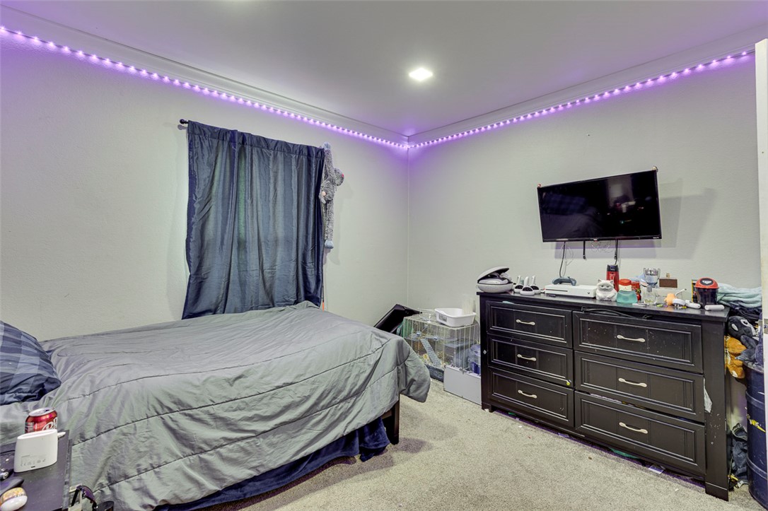 110 Avondale Road Anderson, SC 29624 - Photo 15 of 26 A cozy bedroom with soft carpet flooring and subtle recessed lighting, offering a comfortable personal retreat.