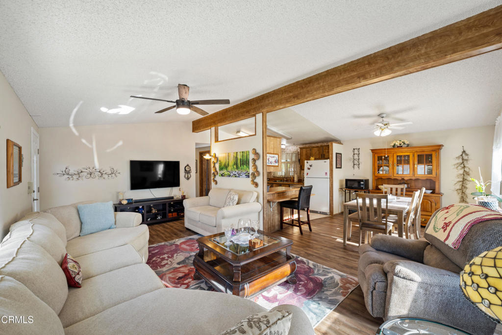 975 West Telegraph Road, Unit 10 Santa Paula, CA 93060 - Photo 4 of 21 a living room with furniture and a flat screen tv