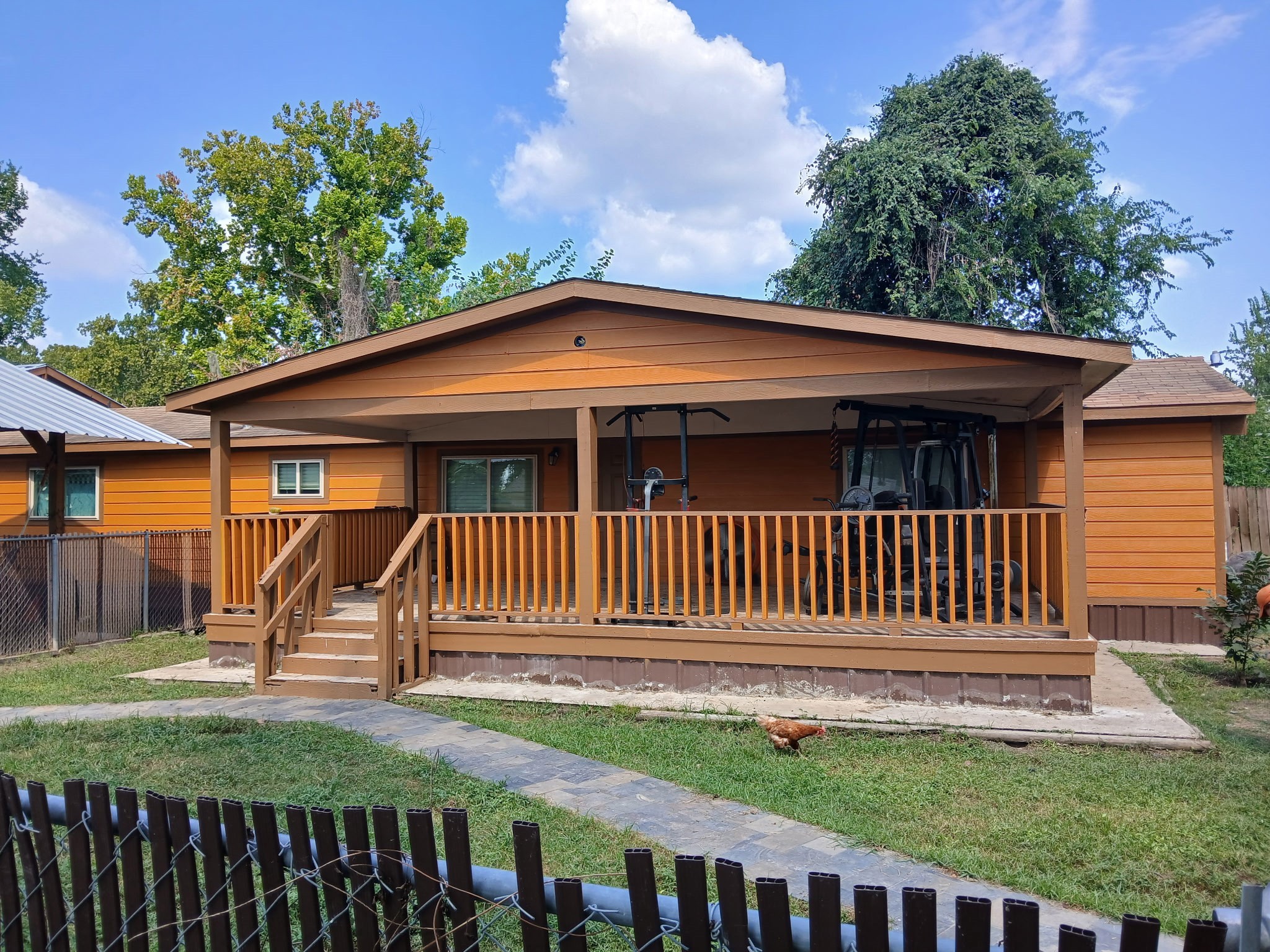 a front view of a house with a garden