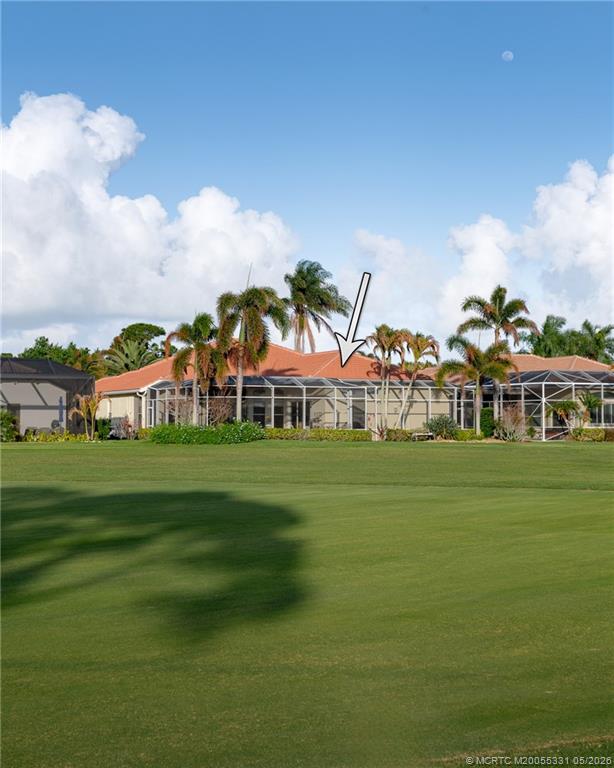 2216 Southeast Stonehaven Road Port St. Lucie, FL 34952 - Photo 37 of 67 a front view of a house with a garden