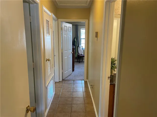 a view of a bathroom from a hallway