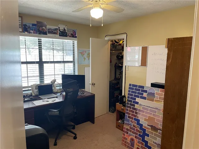 a workspace with furniture and window