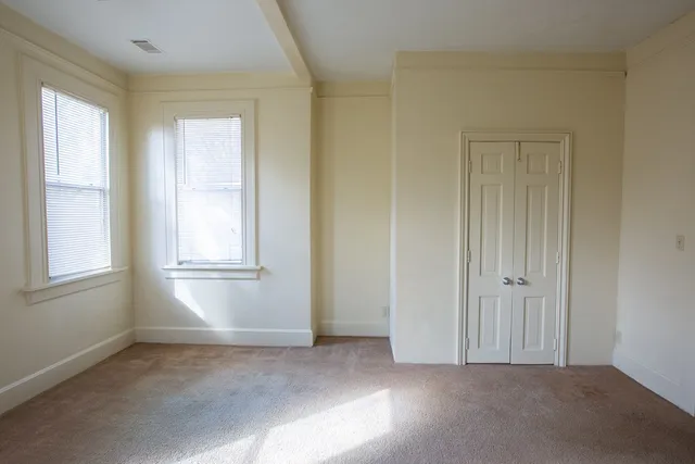 a view of a hallway with stairs