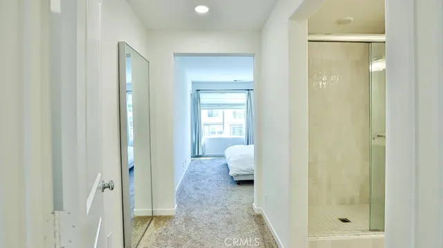 a bathroom with a glass shower door