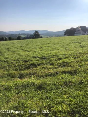 a view of an ocean and a mountain