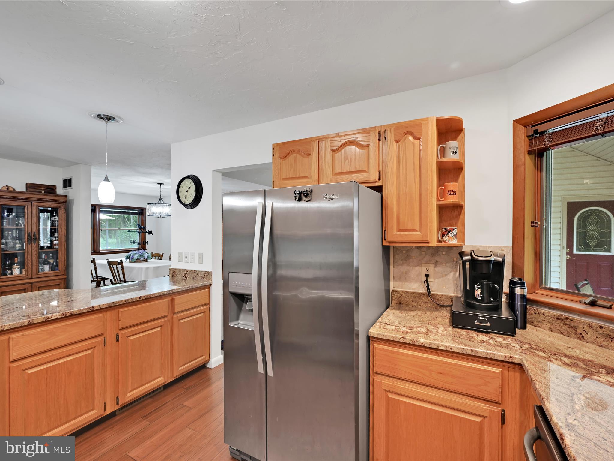 5150 Chestnut Grove Road Spring Grove, PA 17362 - Photo 14 of 56 a kitchen with stainless steel appliances granite countertop a refrigerator a stove and a sink with wooden floors