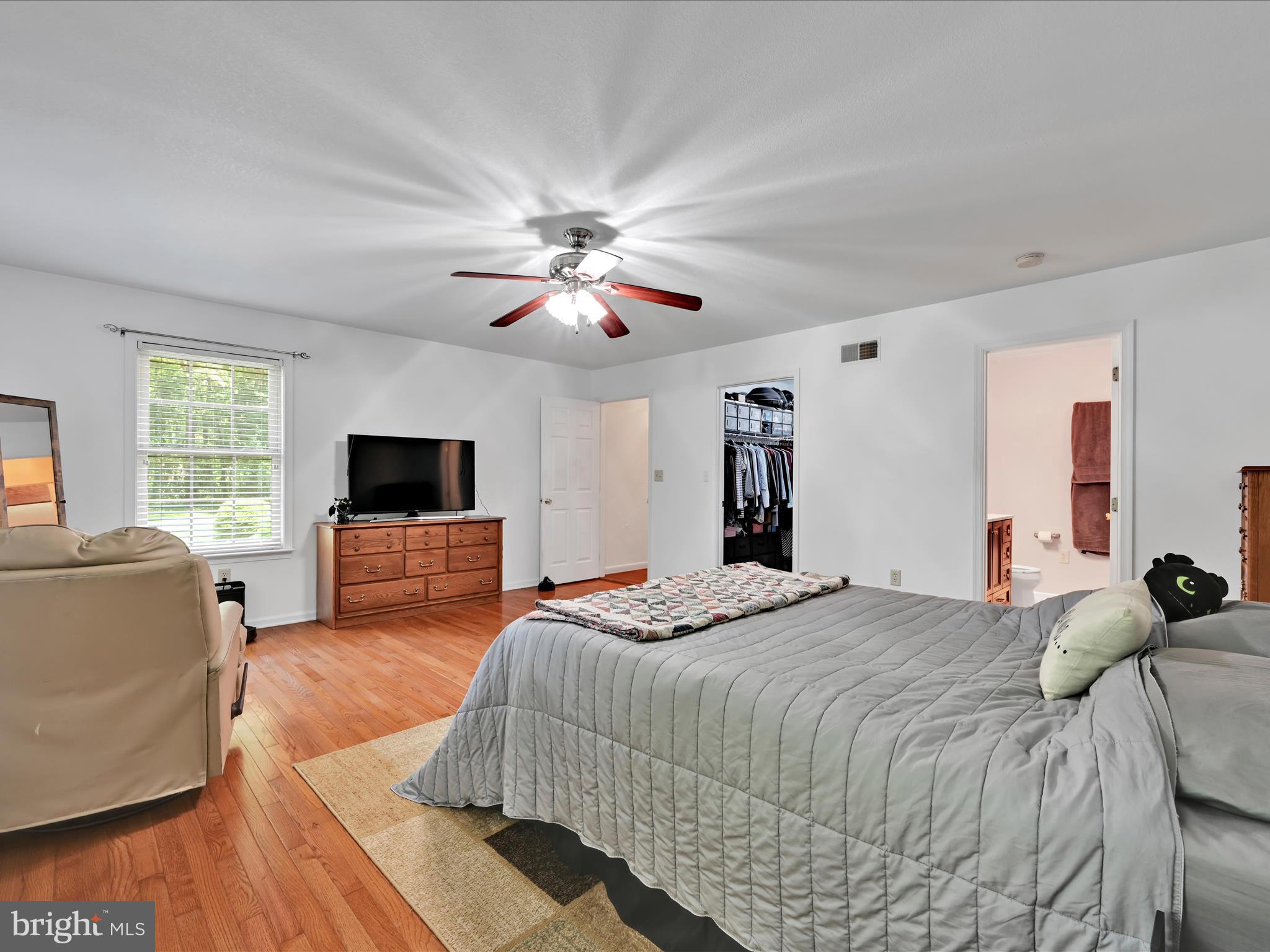5150 Chestnut Grove Road Spring Grove, PA 17362 - Photo 18 of 56 a bedroom with a bed and a flat screen tv