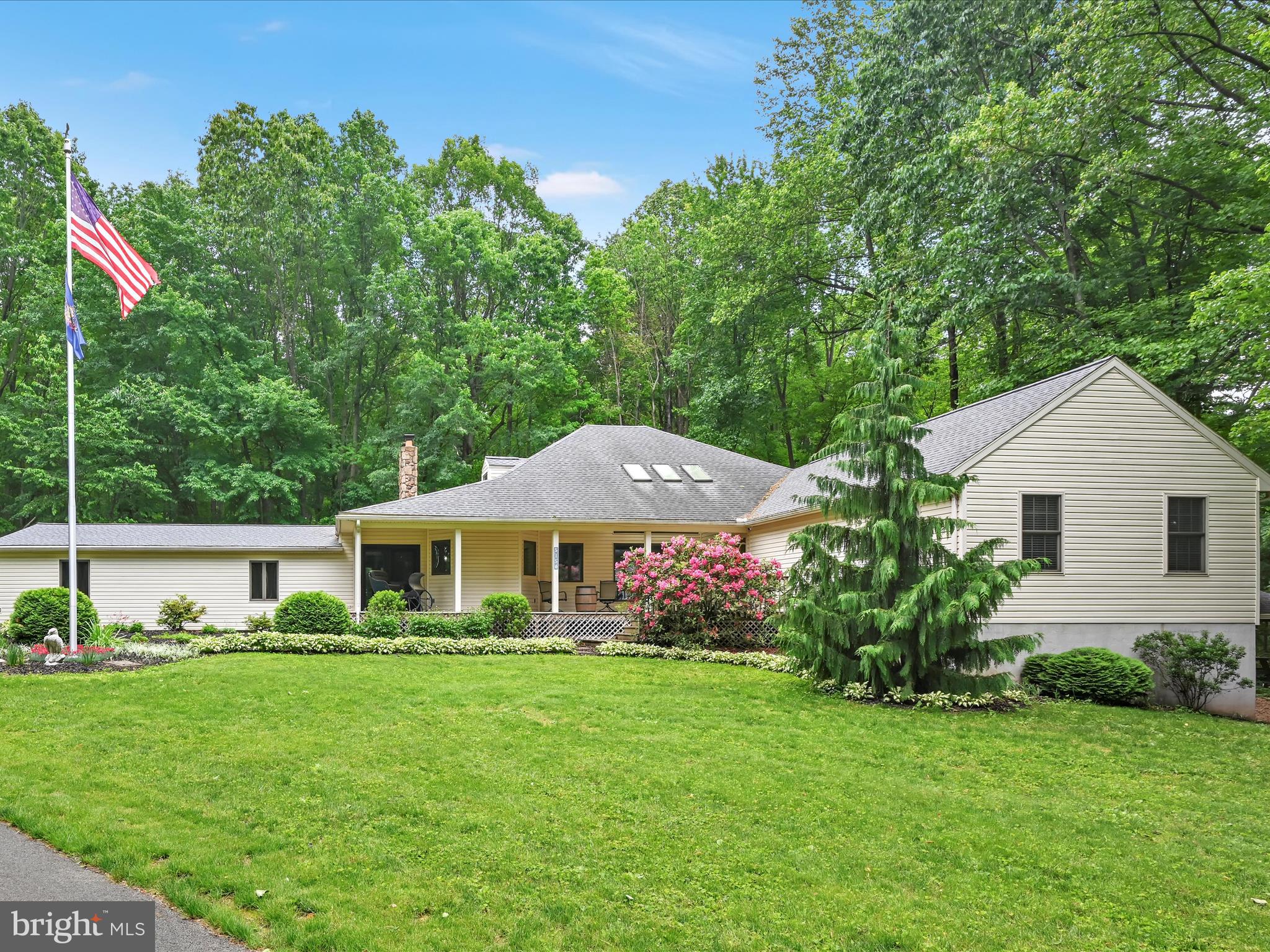 5150 Chestnut Grove Road Spring Grove, PA 17362 - Photo 3 of 56 a front view of a house with garden