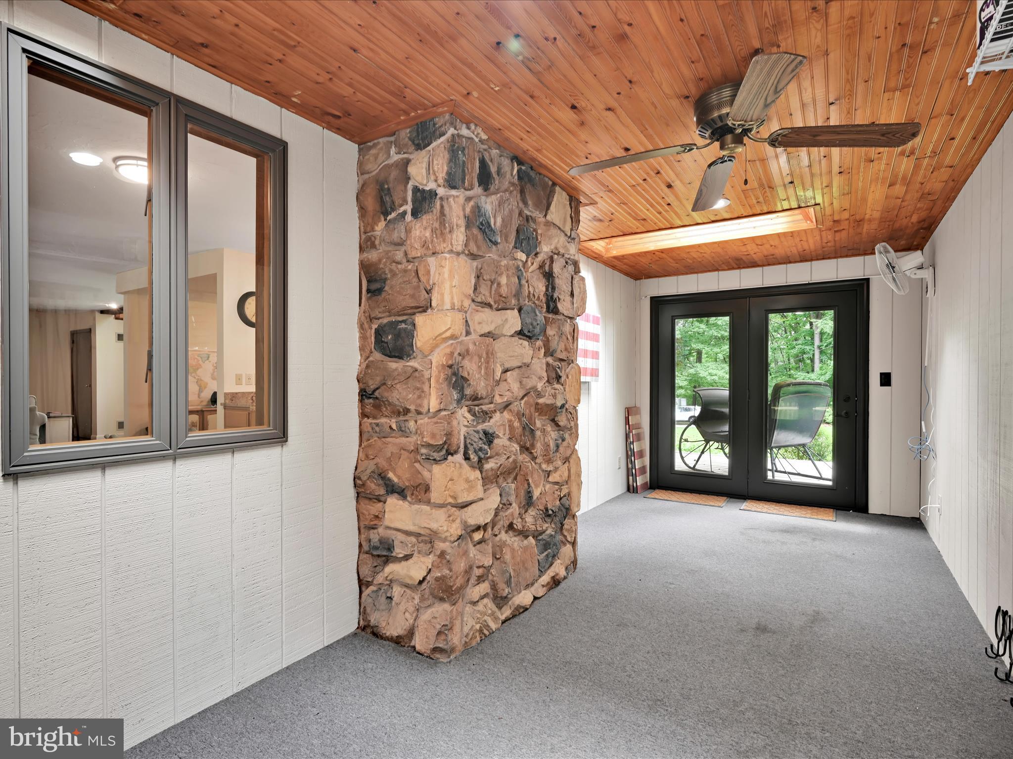 5150 Chestnut Grove Road Spring Grove, PA 17362 - Photo 33 of 56 a view of a room with a large window and chandelier