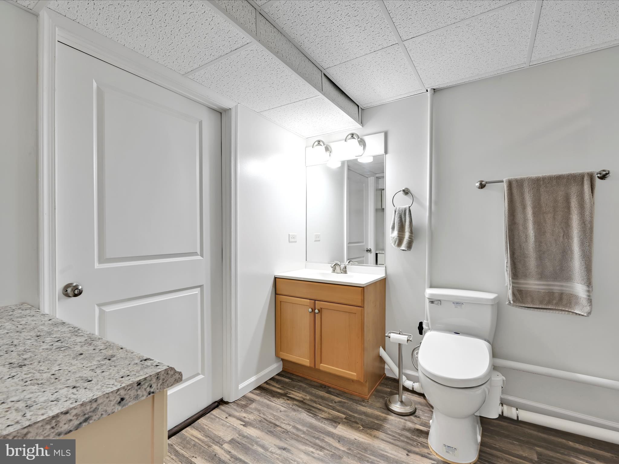 5150 Chestnut Grove Road Spring Grove, PA 17362 - Photo 40 of 56 a bathroom with a granite countertop sink toilet a mirror and shower